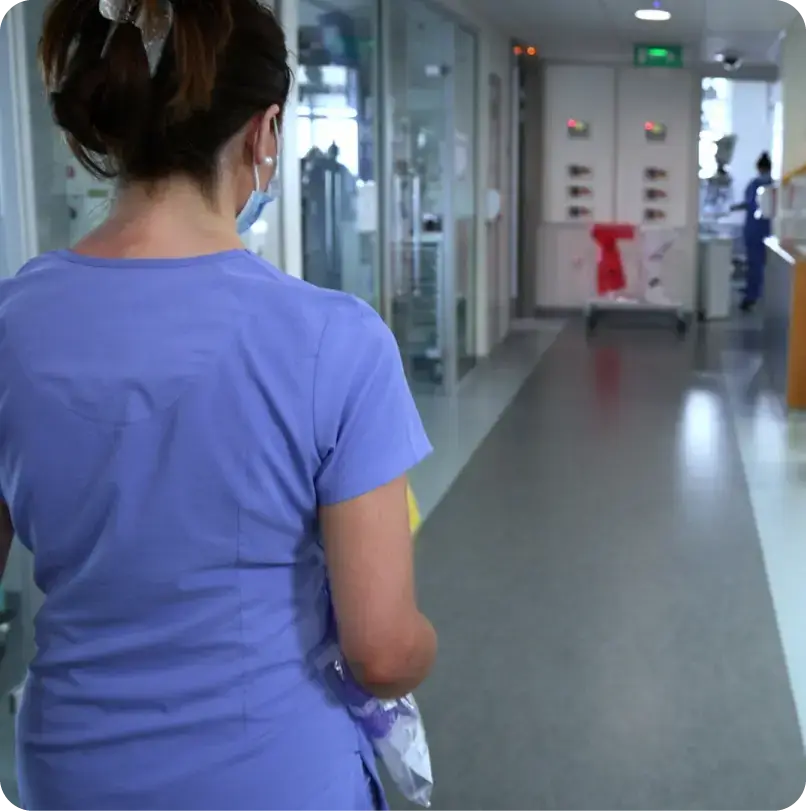 Nurse walking through a ward